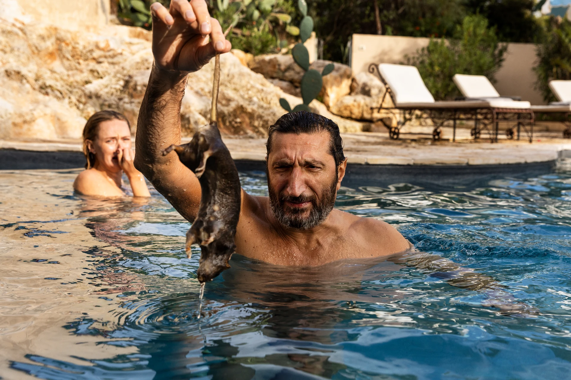 Carl and Helene in a swimming pool in A Couple of Lies