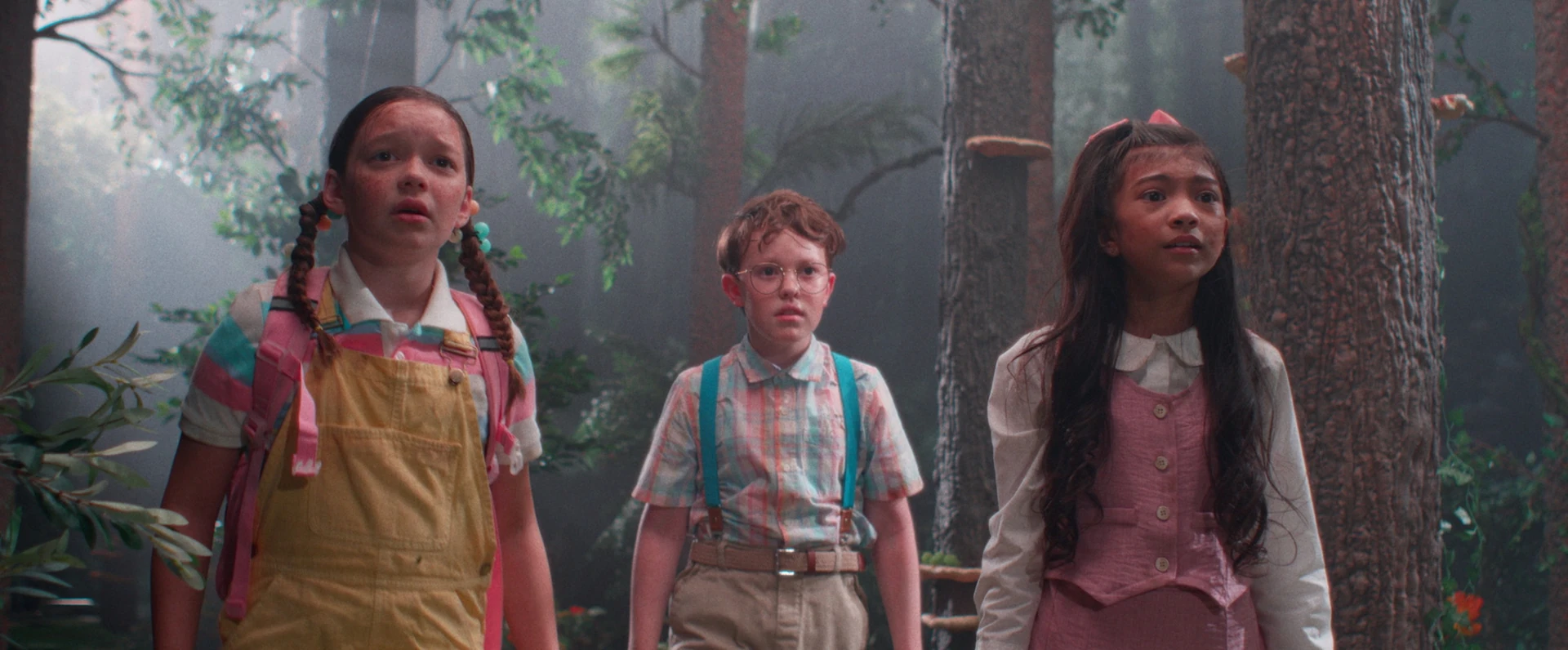 Delaney Quinn, Tristan Borders and Madison Skyy Polan in a forest in Buddy (2026)