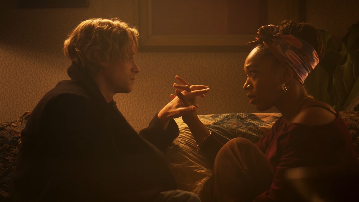 Clayface 2026 Tom Rhys Harries Matt Hagen and Naomi Ackie Caitlyn Corr during intimate conversation
