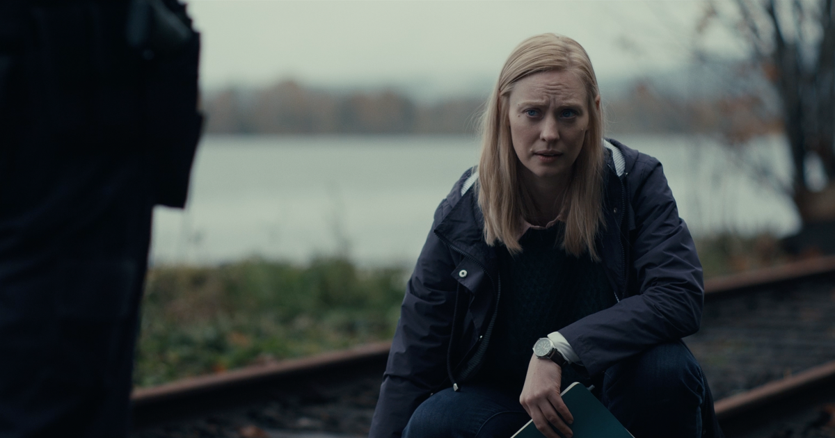 The Cycle (2026) Shudder film — Deborah Ann Woll as Meg in a lakeside scene