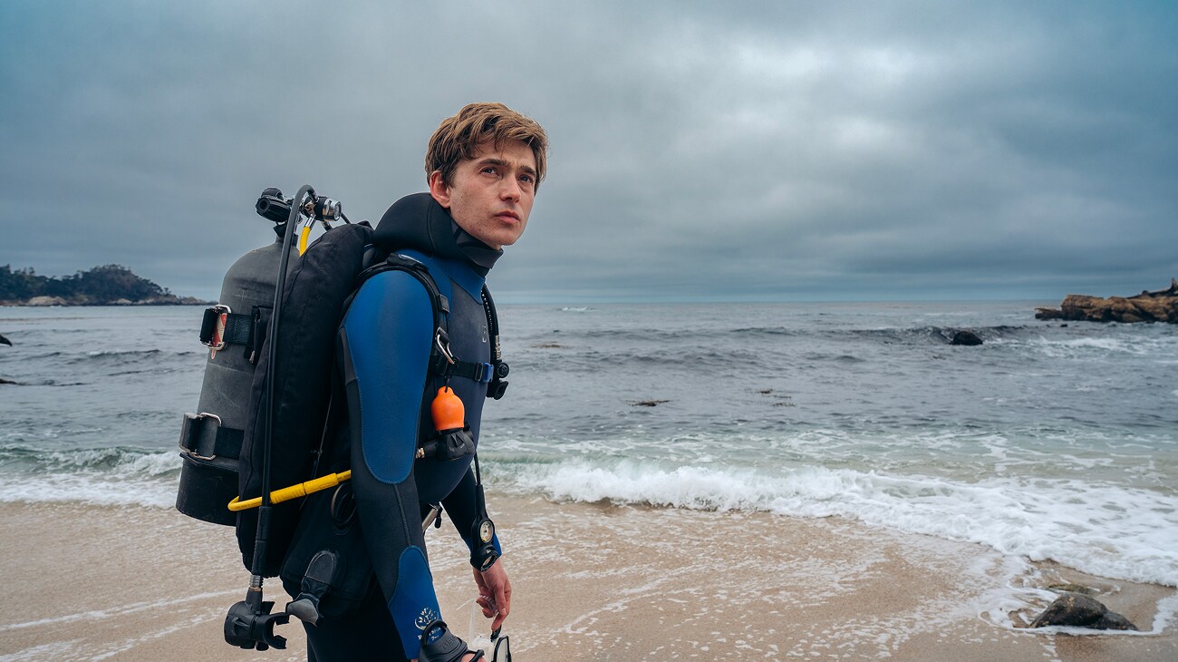 Whalefall (2026) October 16 survival thriller — Austin Abrams wearing scuba diving gear
