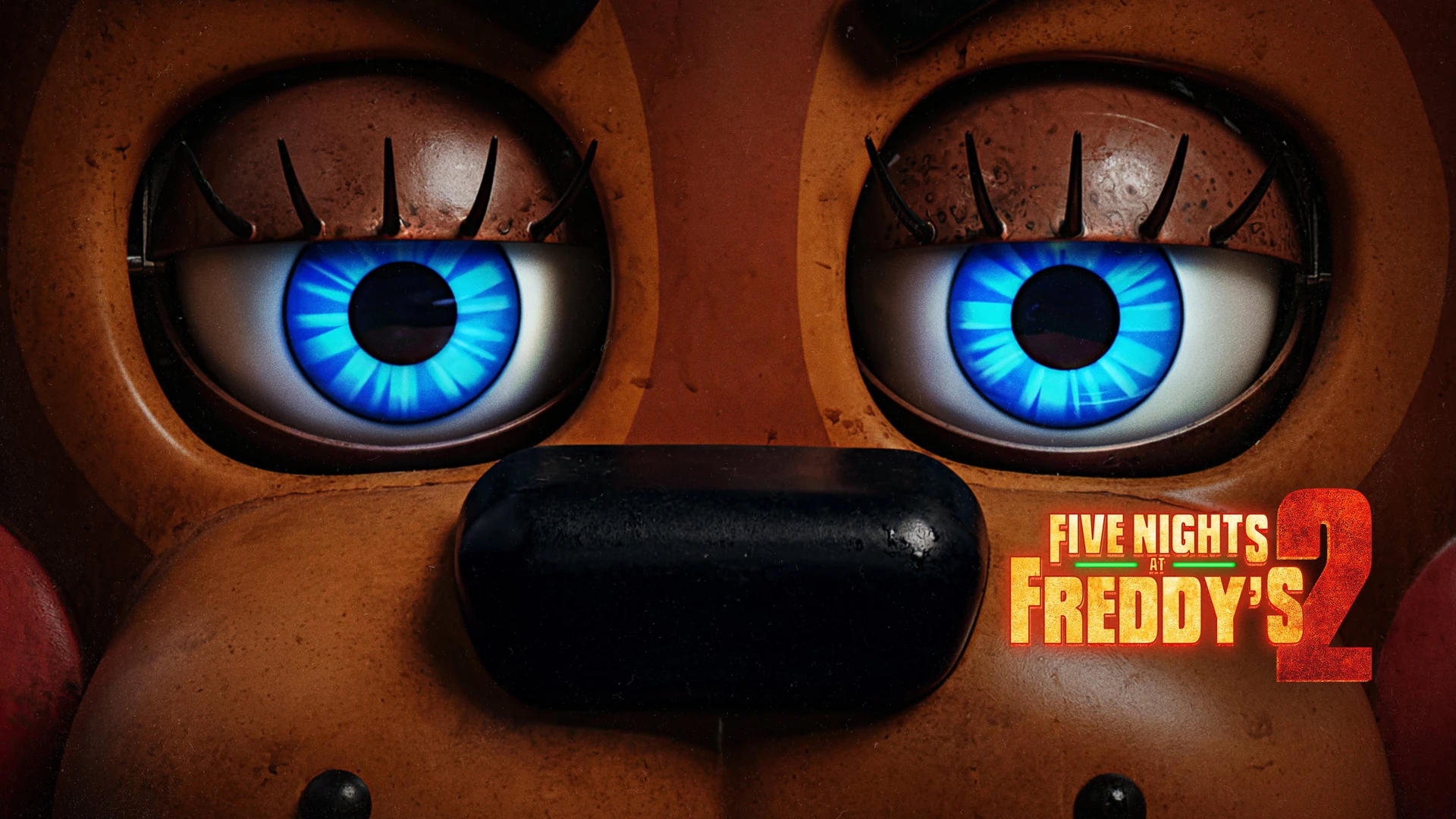 Five Nights at Freddy’s 2 (2025) official artwork with a close-up of Freddy