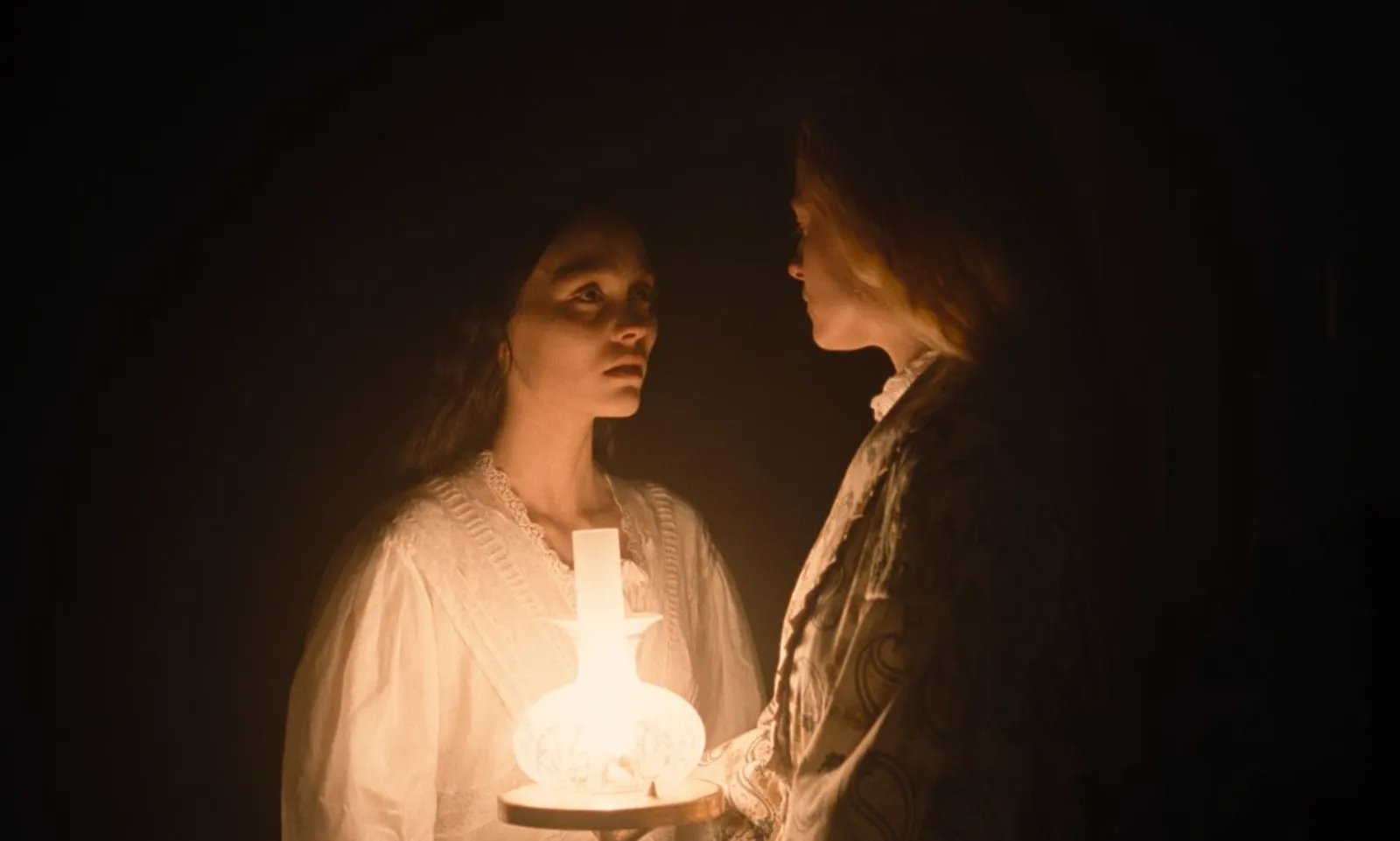 Lily-Rose Depp and Emma Corrin as Ellen and Anna in Robert Eggers' Nosferatu (2024)