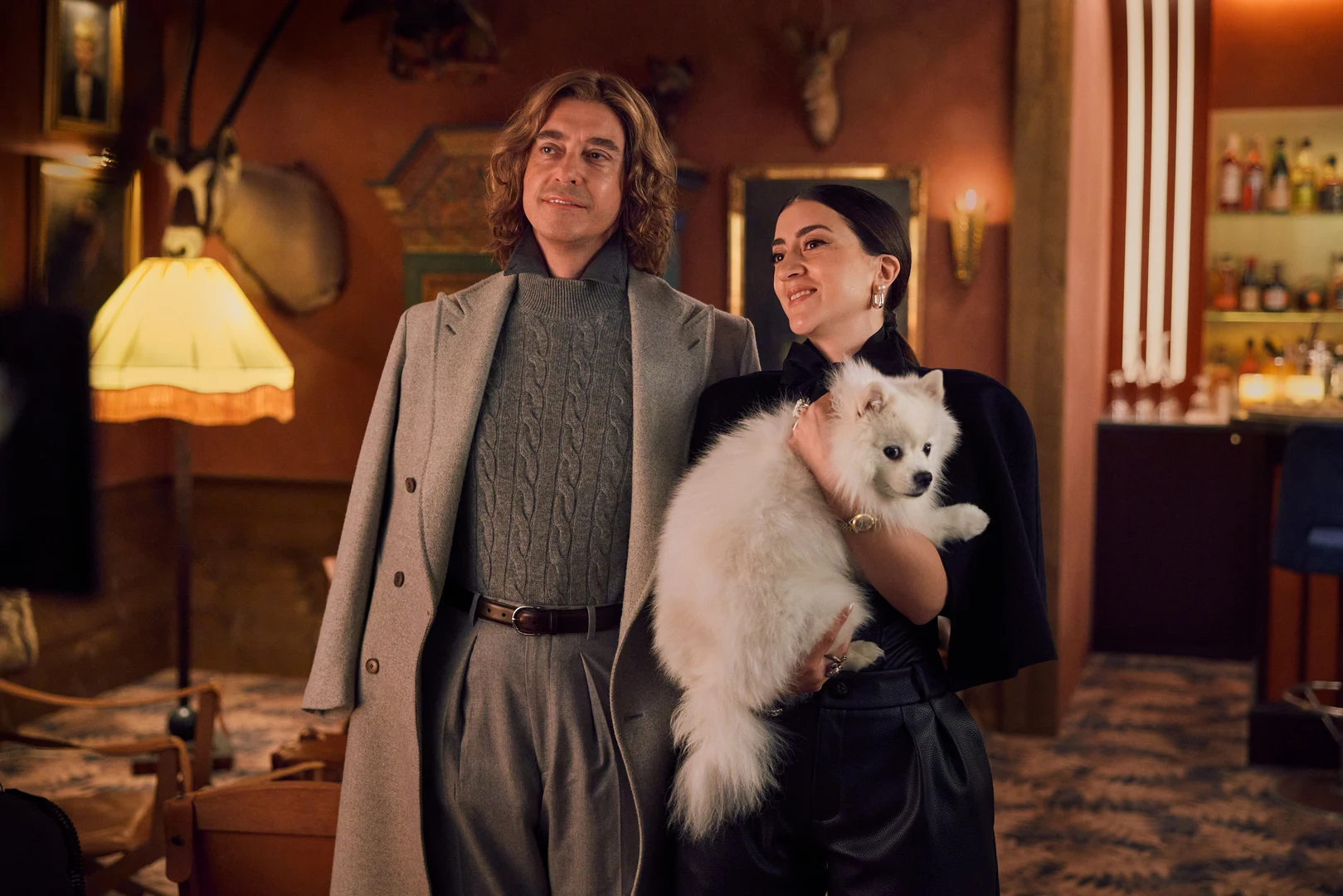 The Storm (2026) — two people with a dog in an interior