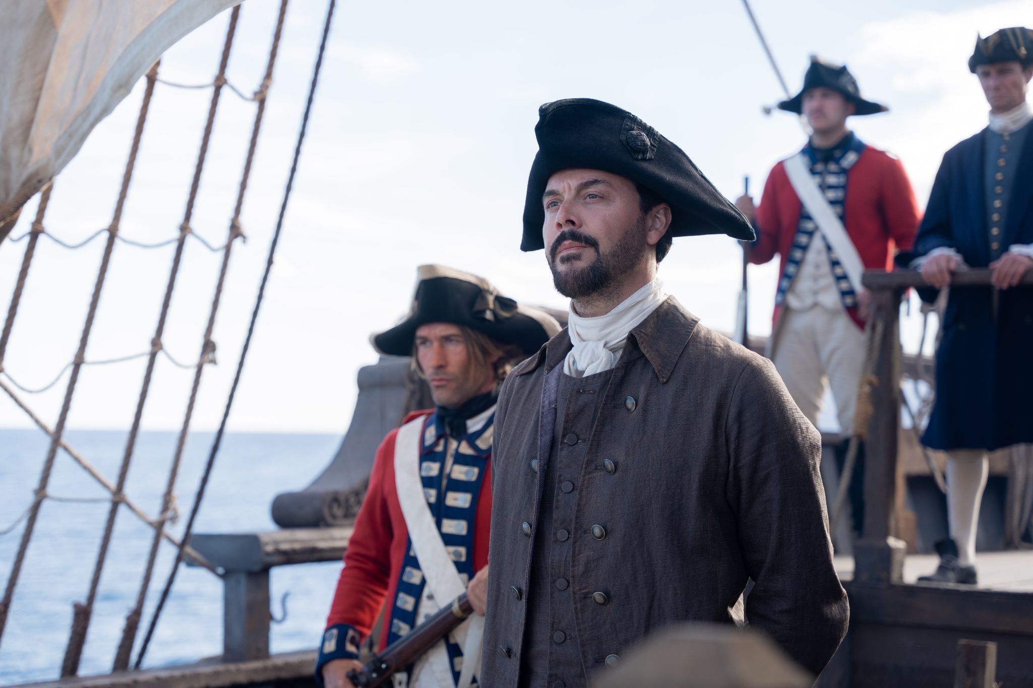 Jack Huston as Aaron Graham aboard ship Treasure Island 2026 in period costume with sailors