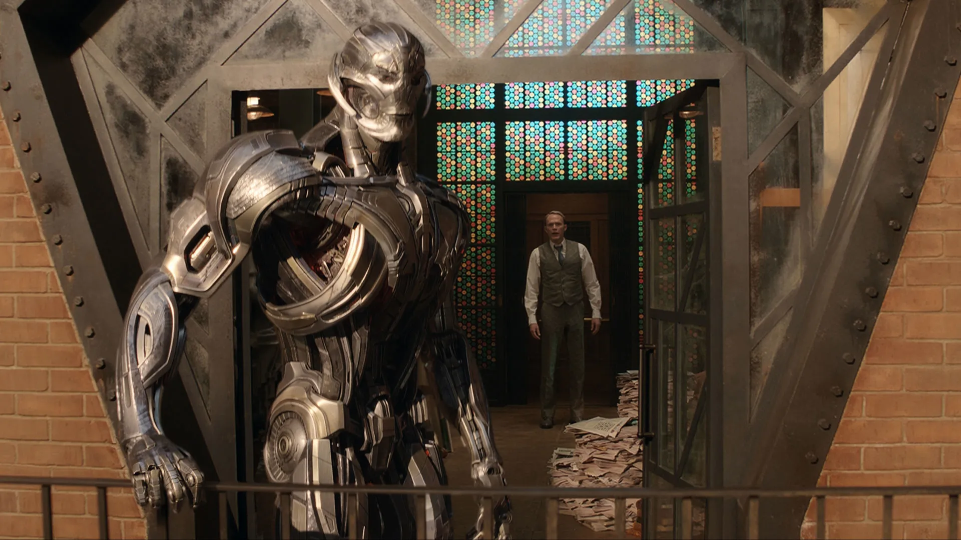 VisionQuest 2026 metallic Ultron robot confronting Vision in doorway Marvel official screenshot