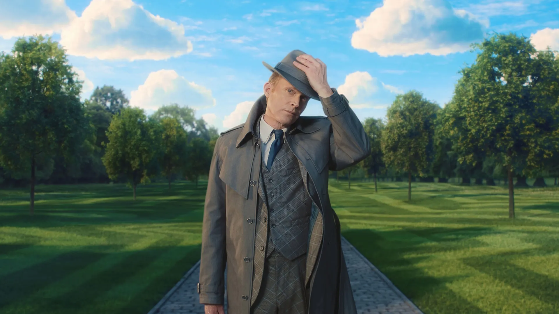 VisionQuest (2026) Paul Bettany as Vision in human disguise with fedora in strange open park